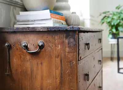 a wooden chest with books on top of it at Deluxe Apartment in Historic Quarter near Beaches in Aberystwyth