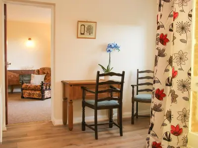 a living room with a table and two chairs at Greenacres in Kimbolton