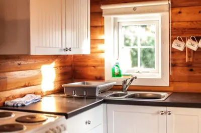 a kitchen with a sink and a window at 3 Bedroom Log Cabin in Snowdonia nr MTB trails in Tanygrisiau