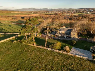 an aerial view of a large house in a field at Bennar Fawr in Dyffryn