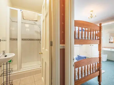 a bathroom with a ladder and a sink and a shower at Edderton Hall Country House in Welshpool
