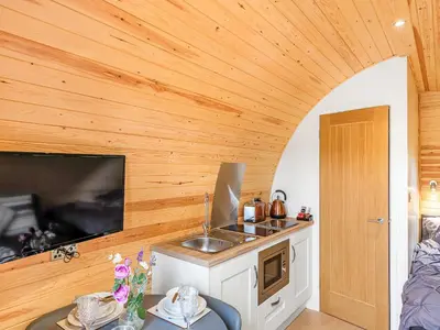 a kitchen with a sink and a counter top at Oak-Uk36258 in Llanfair Caereinion