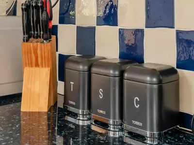 a group of three gas containers sitting on a counter at Robins Nest - Uk36208 in Llanfihangel-y-creuddyn