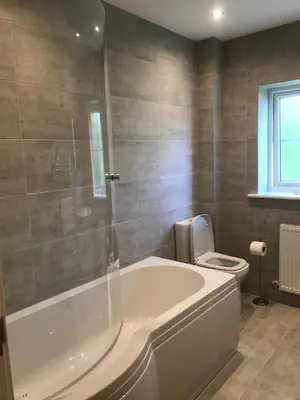 a bathroom with a tub and a toilet at Haul y Bore in Aberystwyth