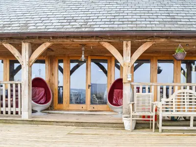 a gazebo with two white chairs and a porch at Ty Nofio - Uk36421 in Talybont
