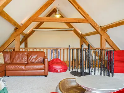 a living room with a couch and a table at Ty Nofio - Uk36421 in Talybont