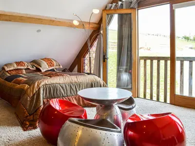 a bedroom with a bed and a table at Ty Nofio - Uk36421 in Talybont