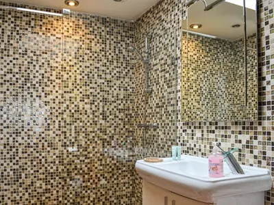 a bathroom with a sink and a shower at Ty Nofio - Uk36421 in Talybont