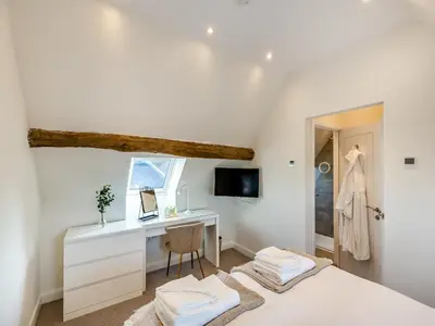 a bedroom with a desk and a bed at Buckley Farm, Barn 1 - Uk36588 in Oswestry