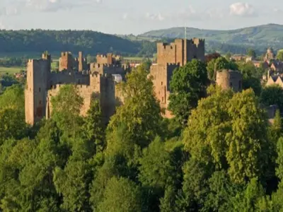 a large castle in the middle of a forest at 2 Bedroom Home Near the Heart of Ludlow - Pass the Keys in Ludlow
