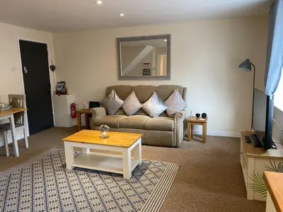 a living room with a couch and a table at Apartment - Sleeps 2 - Pet friendly - Parking in Ludlow