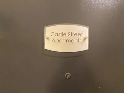 a sign on a door that reads castle street apartments at Apartment - Sleeps 2 - Pet friendly - Parking in Ludlow
