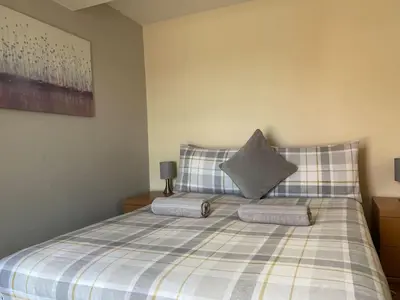 a bedroom with a bed with two pillows on it at Apartment - Sleeps 2 - Pet friendly - Parking in Ludlow