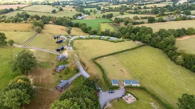 an aerial view of a farm with a group of farms at Hares Rest in Rhayader