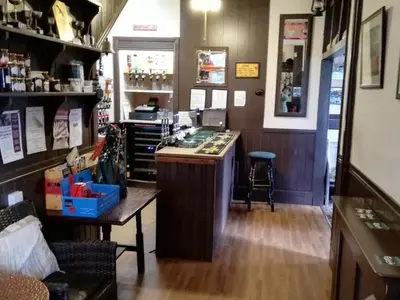a bar in a store with a counter in a room at Lion Hotel in Llanbister