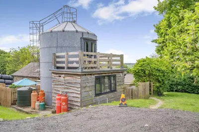a small house with a tower on top of it at 1 Bed in Aberaeron oc-bow300 in Henfynyw Upper
