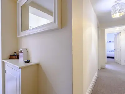 a hallway with a mirror on the wall at Apartment 1 - Uk32244 in Aberdyfi