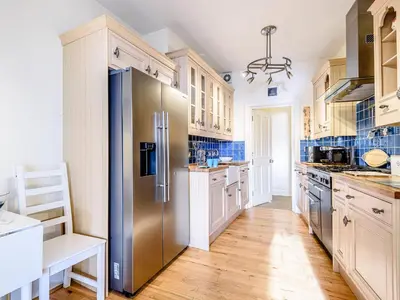 a large kitchen with a stainless steel refrigerator at Apartment 1 - Uk32244 in Aberdyfi