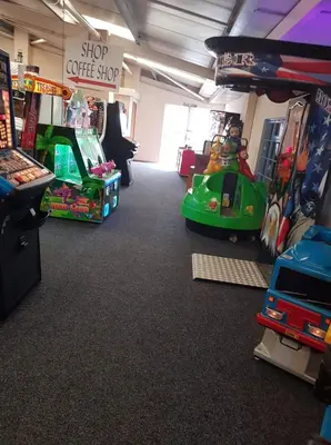 a room with a coffee shop with toys in it at C8 in Aberystwyth