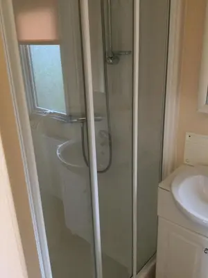 a bathroom with a shower and a sink at C8 in Aberystwyth