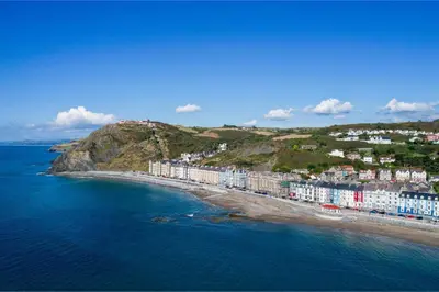 an aerial view of a beach with buildings and the ocean at 1 Bed in Aberystwyth oc-bow286 in Aberystwyth