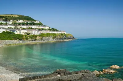 a view of a beach with houses on a hill at 4 Bed in New Quay oc-bow272 in New Quay