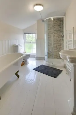 a bathroom with two sinks and a tub and a shower at 4 Bed in New Quay oc-bow272 in New Quay