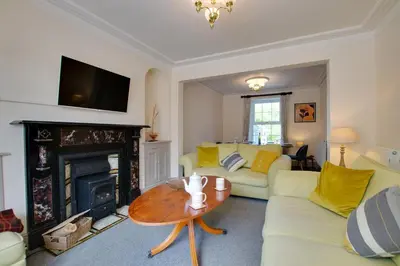 a living room with a couch and a fireplace at 4 Bed in New Quay oc-bow272 in New Quay