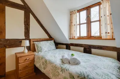 a bedroom with a bed with towels on it at 2 Bed in Y Drenewydd oc-waa401 in Llanllugan
