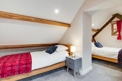 a bedroom with two beds in a attic at 4 Bed in Dinas Mawddwy oc-bow305 in Aber Cowarch