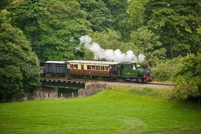 a train on a bridge with smoke coming at 2 Bed in Y Drenewydd oc-waa402 in Llanllugan