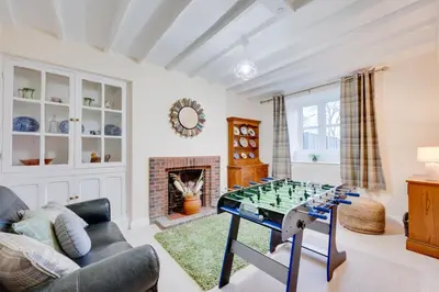 a living room with a glass chess board on a table at 3 Bed in Machynlleth oc-bow306 in Darowen