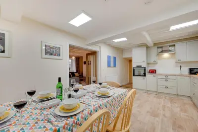 a kitchen and dining room with a table and chairs at 3 Bed in Machynlleth oc-bow306 in Darowen