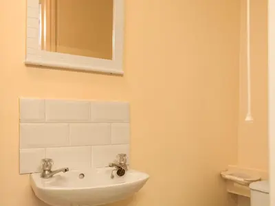 a bathroom with a sink and a mirror at Border View in Kington
