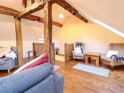 a living room with two couches and chairs at Yr Hen Felin in Oswestry