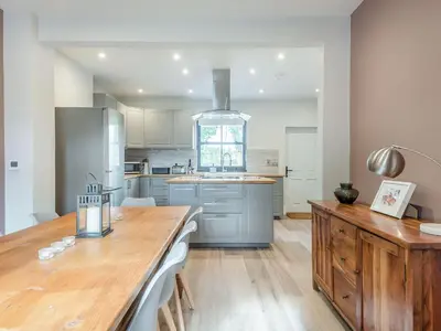 a kitchen with a wooden counter top in a room at Gwrlodde in Talgarth