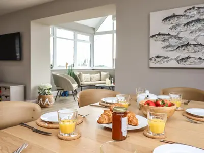 a table with food and drinks and a bowl of fruit at Bryn Hafod in Dyffryn