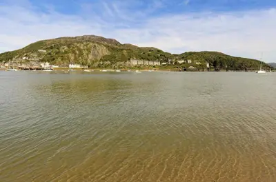 a large body of water with a mountain in the background at 2 Bed in Dolgellau oc-bow284 in Trawsfynydd