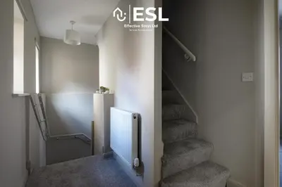a staircase in a room with a stair case at Comfy Modern 2 Bedroom Duplex Apartment with Sun Terrace in Shrewsbury