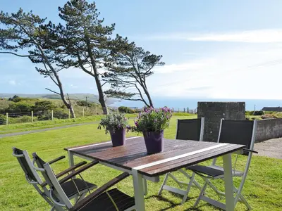 a wooden table with two potted plants on it at Seascape in Aberystwyth