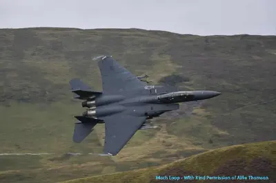 a fighter jet is flying in the sky at 1 Park Terrace in Corris