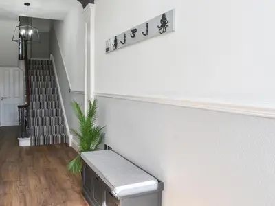 a stairway with a bench in a hallway at Ty Isaf in Barmouth