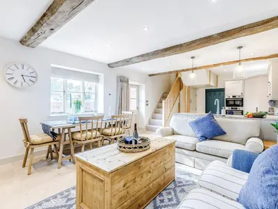 a living room with a couch and a table at Little Whitley - Uk38099 in Great Hanwood