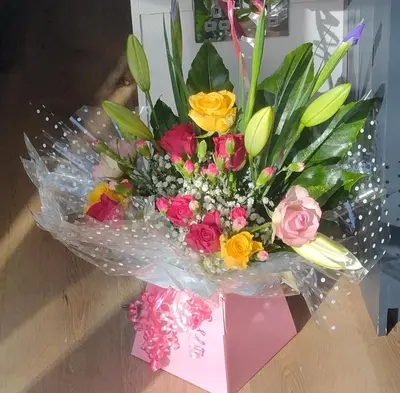 a bouquet of flowers sitting on a table at Sheep Dip Cottage - 5* Cyfie Farm, with log burner and private hot tub in Llanfyllin