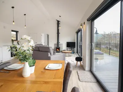 a living room with a couch and a table at The Sheep Shed in Oswestry