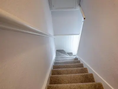 a staircase in a room with a stair case at Central cosy home 5 minutes walk from Shrewsbury - Pass the Keys in Shrewsbury