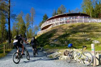 two people riding bikes on a gravel road at 2 Bed in Dolgellau oc-bow282 in Trawsfynydd