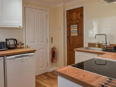 a kitchen with a sink and a counter top at Morannedd Bach in Dyffryn