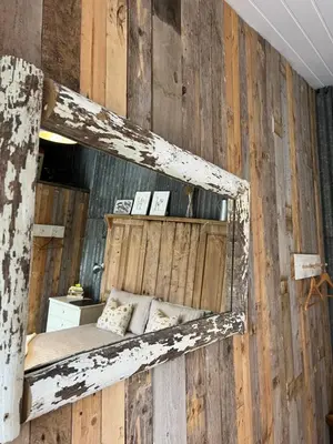 a wooden wall with a bed in a room at The Pig and Sty in Hereford