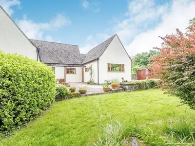 a white house with a yard in front of it at Cwmfron House in Llanidloes